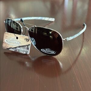 Realtree Polarized 100% UVA/UVB protection sunglasses, camo print arm,gold frame